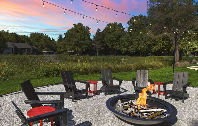 Firepit with lounge seating at dusk
