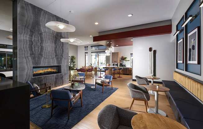 A modern living room with a fireplace and comfortable seating.