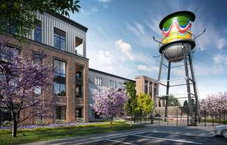 an artist rendering of a water tower in front of a building at Link Apartments® Broad Ave, Tennessee