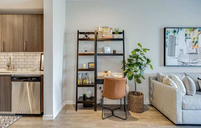 a living room with a couch and a table with a chair