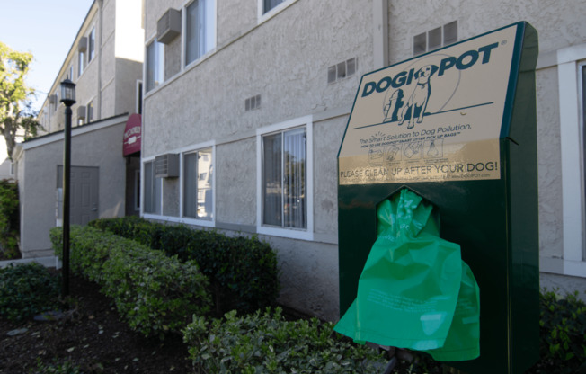 A sign for DoggiePot Law is displayed in front of a building.