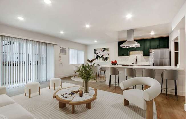 A modern living room with a white sofa set and a wooden coffee table.