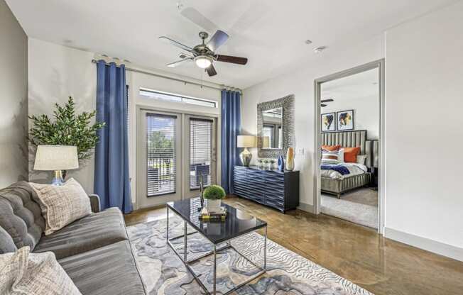 Stylish living room with modern furniture and decor at Allusion at West University apartments in Houston, TX