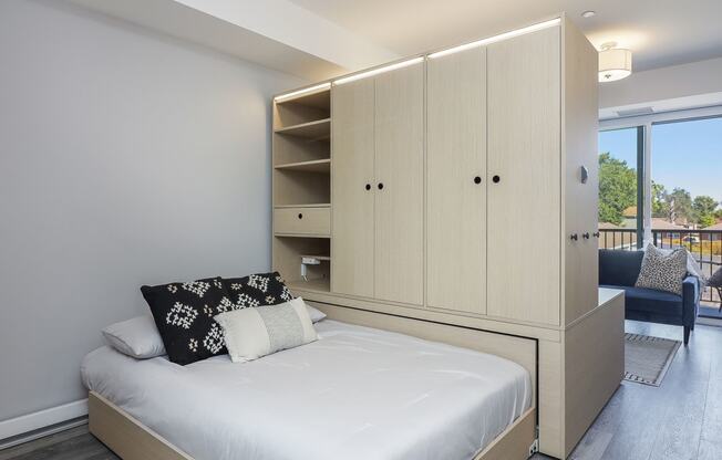 a bedroom with a large bed and a closet