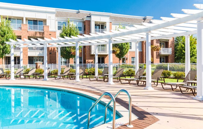 the swimming pool at the falls at rolland park apartments