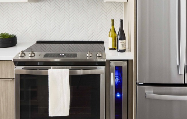 Embrace eco-friendly living with Modera Clarendon's ENERGY STAR stainless steel appliance package, combining sustainability with style for your modern kitchen.