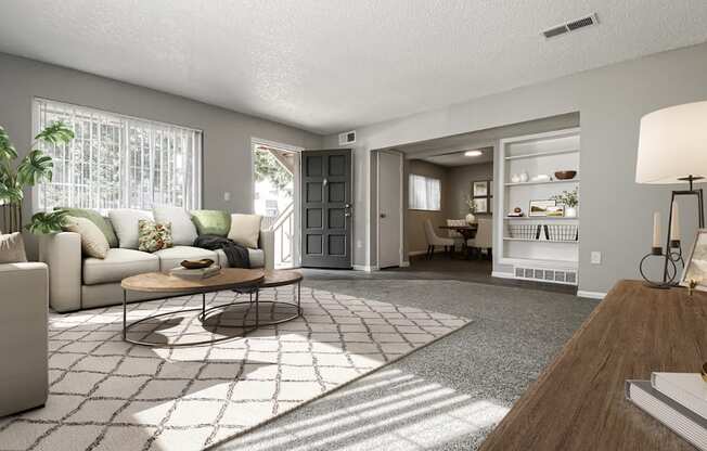 A living room with a couch, a coffee table, and a lamp.