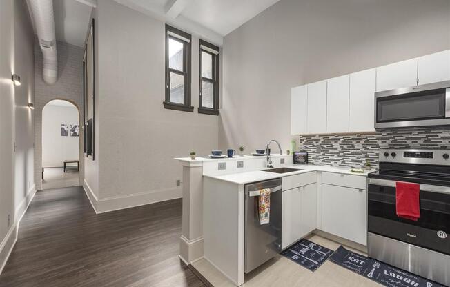 a kitchen with a stove top oven next to a sink