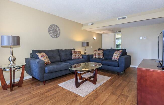 a living room filled with furniture and a tv