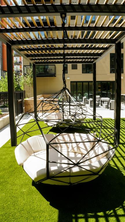 outdoor courtyard with shaded swings