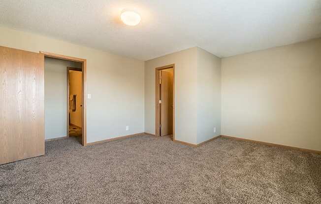 Bedroom with large walk in closet for extra storage at Skyline View Apartments in Lincoln NE