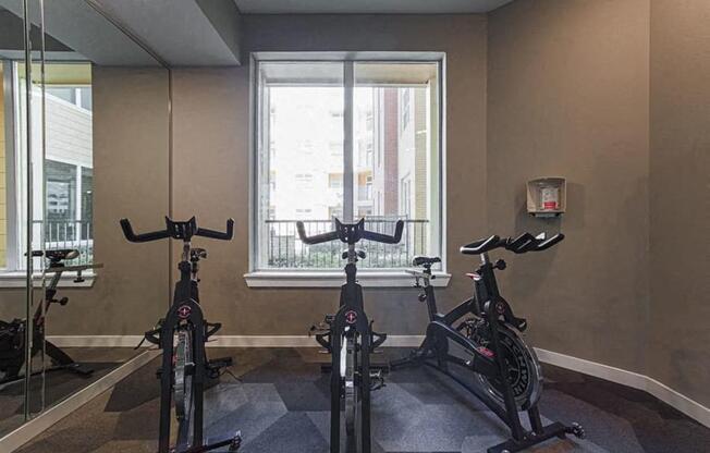 fitness center with cardio equipment at Aspire at 610 apartments