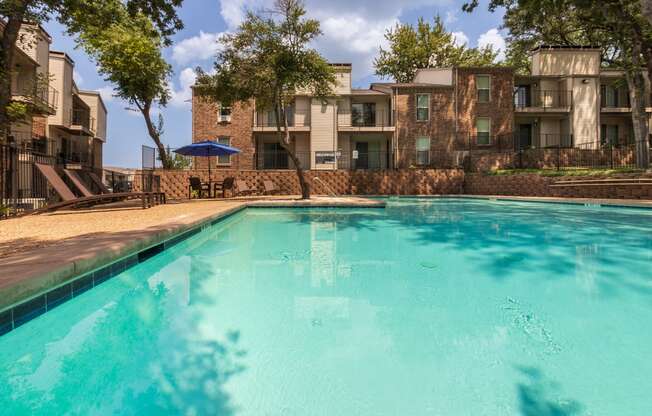 This is a photo of the pool area at Canyon Creek Apartments in Dallas, TX.