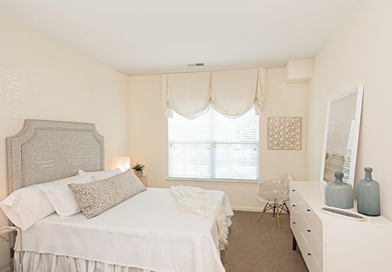 Bedroom with window; carpet