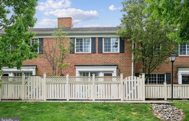 Welcome to this beautifully updated three bedroom, two and a half bath brick townhome in the sought after Parkside at Alexandria.