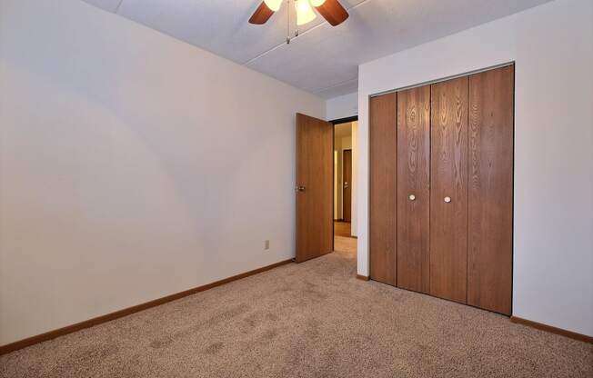 a bedroom with a closet and a door to a hallway. at France, North Dakota