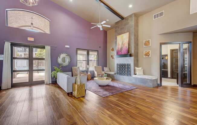 the preserve at ballantyne commons living room with purple walls and wood floors