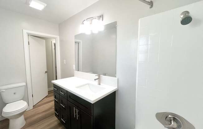 an empty bathroom with a sink and a toilet