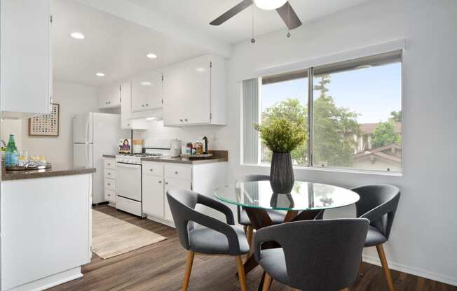 a kitchen and dining area in a 555 waverly unit