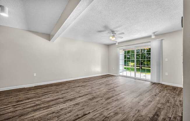 Spacious Living Area With Wood-Style Flooring