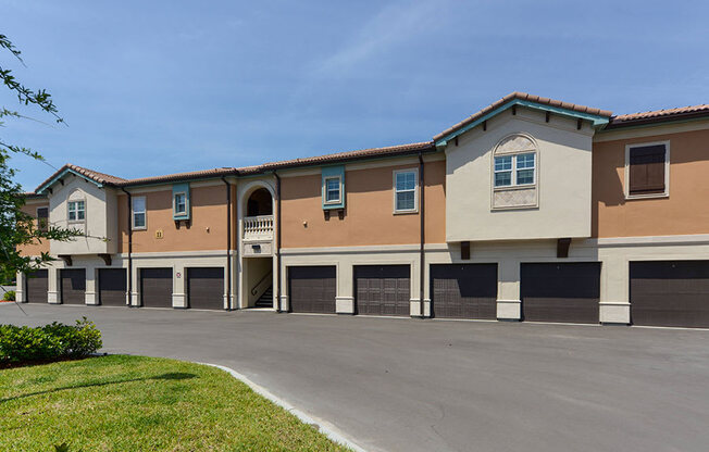 a building with a parking lot in front of it  at Hacienda Club, Florida