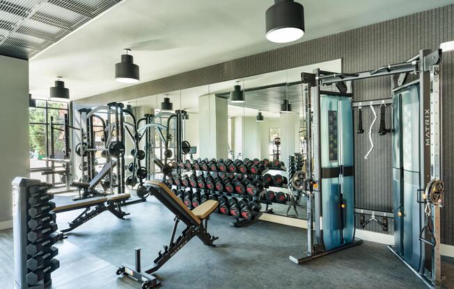A well-equipped fitness center with strength training, free weights, and open space designed to support a wide range of workouts and routines.