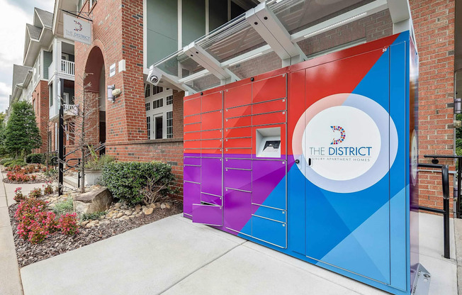 A colorful gate with The District on it.