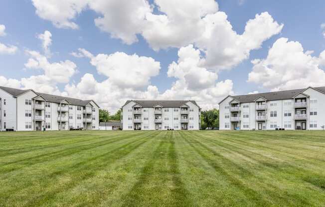 Apartments In Indianapolis, IN For Rent - Riverchase - Beautifully Landscaped Courtyard In Front Of Apartment Buildings
