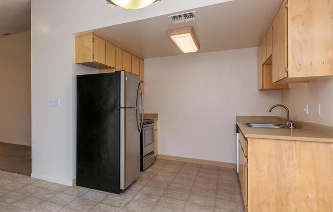 a kitchen with a tile floor