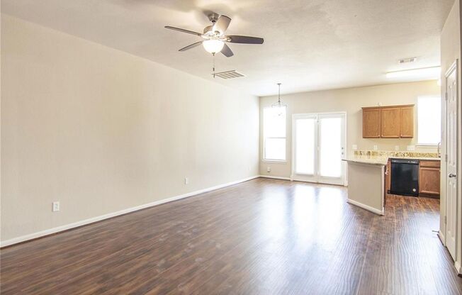 Highly upgraded 3 bedroom, 2 and half bath townhome with washer and dryer, granite kitchen counter tops, newly renovated bathrooms including a walk-in shower in master bathroom, and new refrigerator. Engineered hardwood floor and ceramic tiles in all livi