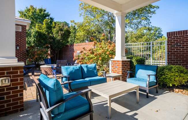 the preserve at ballantyne commons spacious patio with blue chairs and tables