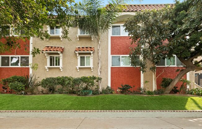 Marina Del Rey CA Apartments - Exterior View of the Property Showcasing Colorful Building and Green Landscaping