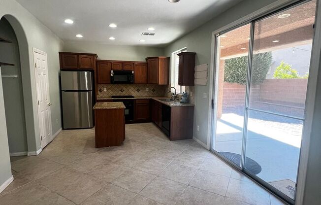 Spacious 4-Bedroom Mountains Edge Home with Downstairs Suite, Balcony & Covered Patio