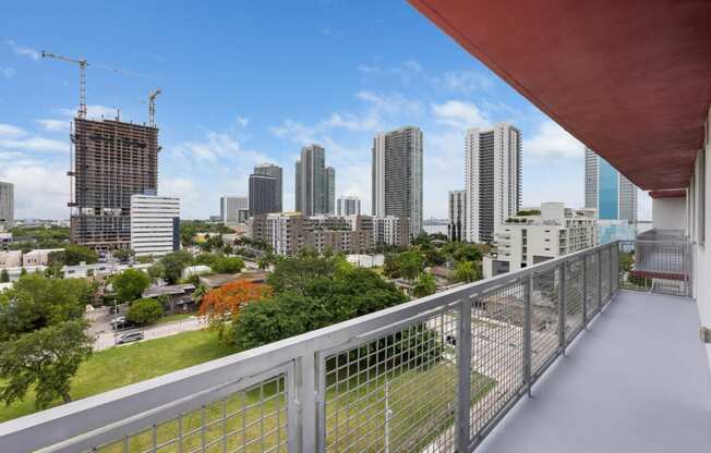 a view of the brisbane city skyline from a balcony