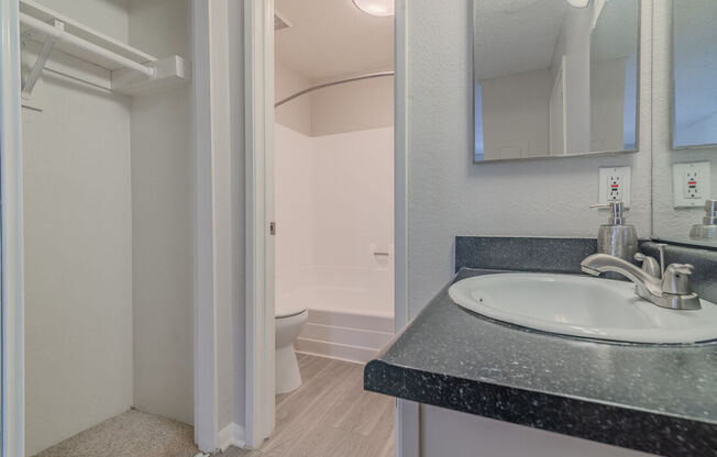 a bathroom with a sink and a toilet at City View Apartments at Warner Center, Woodland Hills, CA 91367