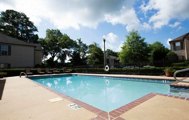 swimming pool and seating at Village at Caldwell Mill Apartments in Birmingham, Alabama