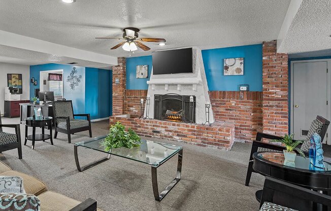 a living room with a brick fireplace and a television