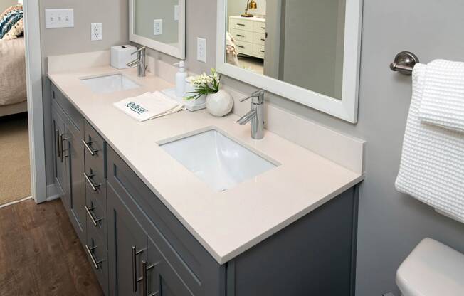 a bathroom with a sink and a mirror at One Riverside Apartments, Tennessee, 37403