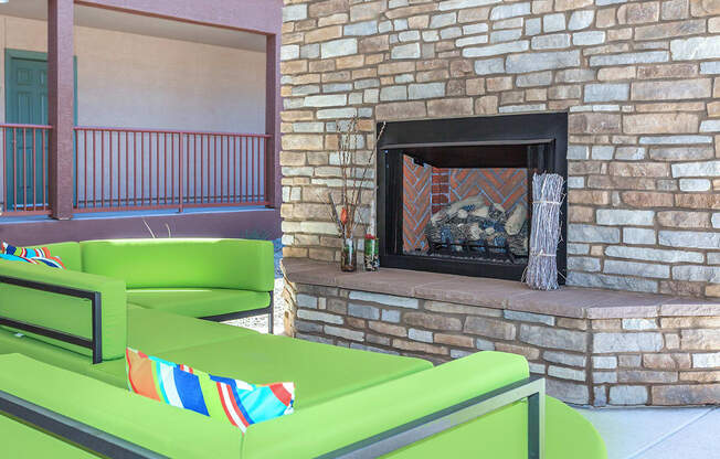 Outdoor Fireplace in front of plush seating area
