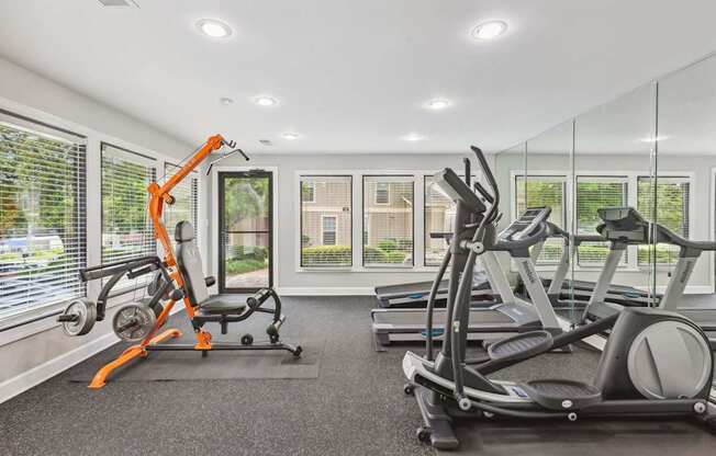 A gym with orange and black equipment.