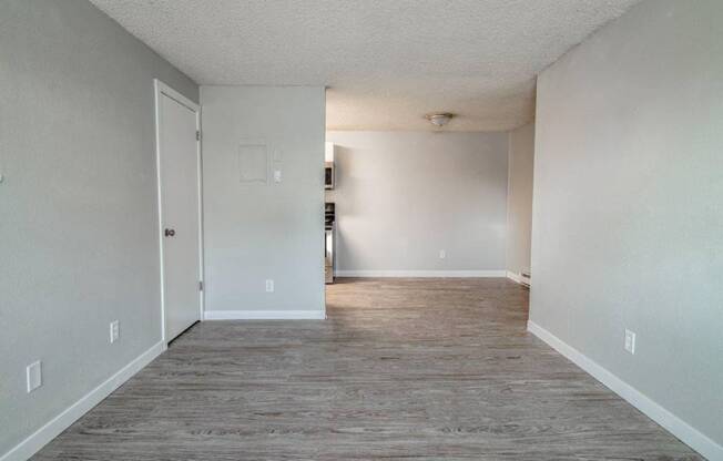 A room with a grey floor and white walls.