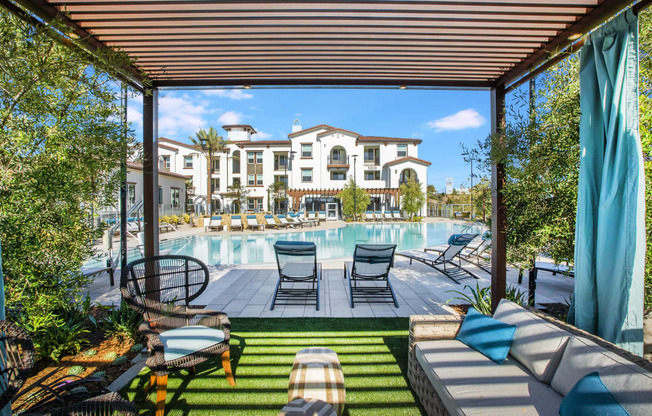 a swimming pool with lounge chairs