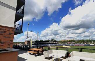 the deck of the apartment building has a view of the marina