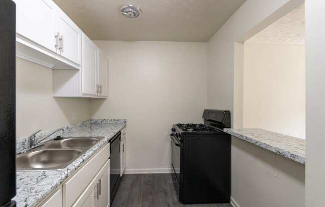 This is a photo of the kitchen in the 543 square foot A-style, 1 bedroom, 1 bath apartment at Blue Grass Manor Apartments in Erlanger, KY.