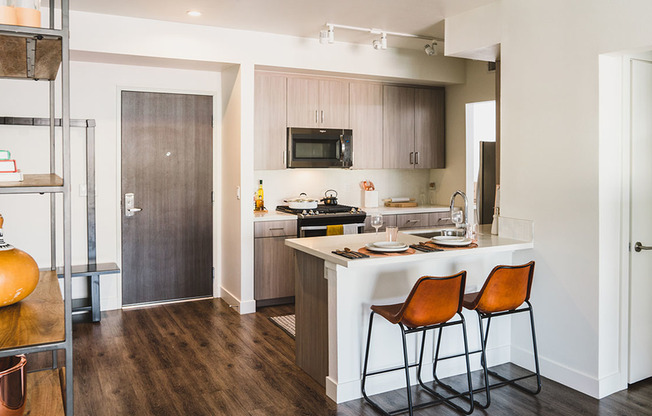 Chef-inspired kitchens enhance your entertaining skills with Caesarstone® quartz countertops, tile backsplashes and under-cabinet task lighting