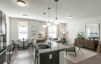 an open kitchen and living room with a table and chairs at Village at Westland Cove Apartments, Knoxville, TN, 37922