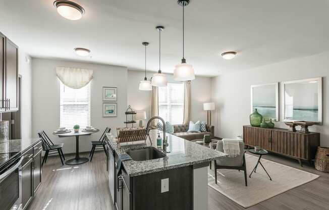 an open kitchen and living room with a table and chairs at Village at Westland Cove Apartments, Knoxville, TN, 37922