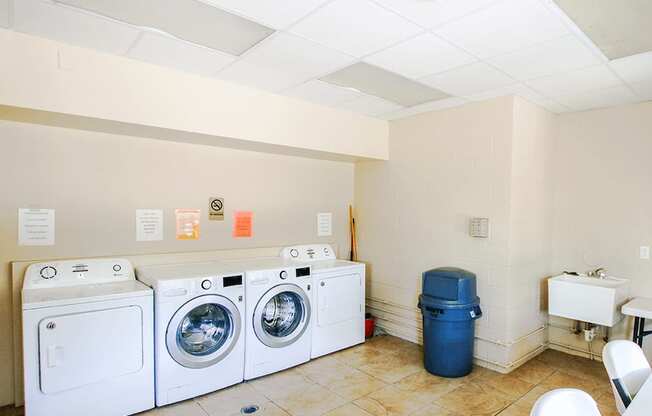 a laundry room with washing machines