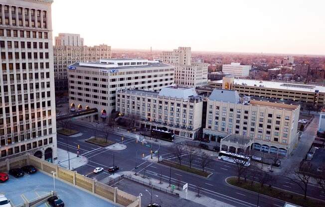 a view of a city from above of a parking lot