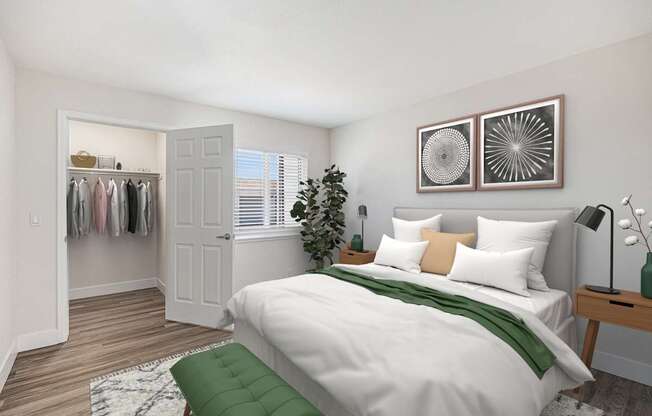 A bedroom with a white bed and a green pillow.